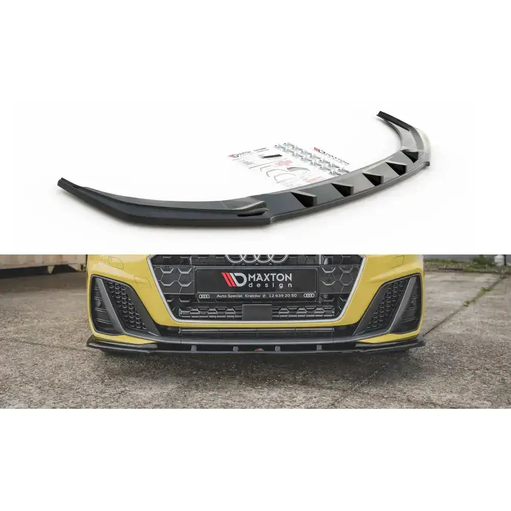 Frontleppe V.1 Audi A1 S-Line GB i sort plast sett skrått forfra, montert på gul bil med utstyr.