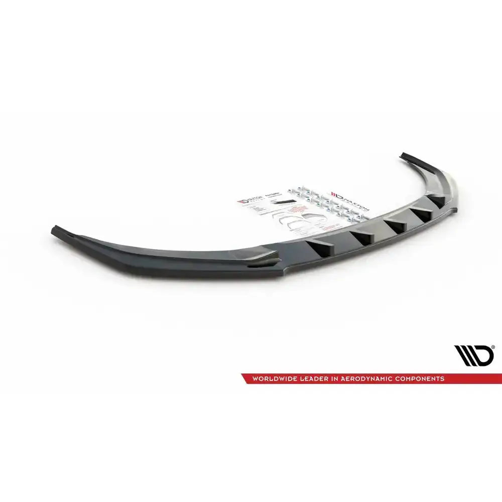 Frontspoiler til Audi A1 S-Line GB, sort plast, sett fra siden med monteringsutstyr i bakgrunnen.