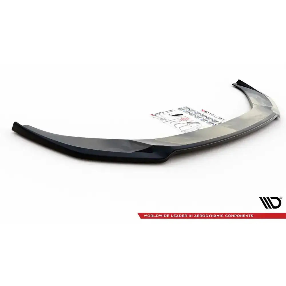 Frontspoiler Audi A6 S-Line V.1 svart plast, sett skrått ovenfra med festedeler og monteringsanvisning.