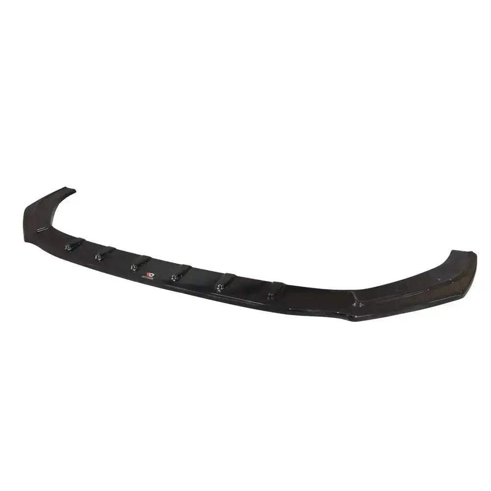 Frontspoiler til Audi RS5 F5 Coupe/Sportback, sort og blank med ribber, sett skrått ovenfra mot hvit bakgrunn.