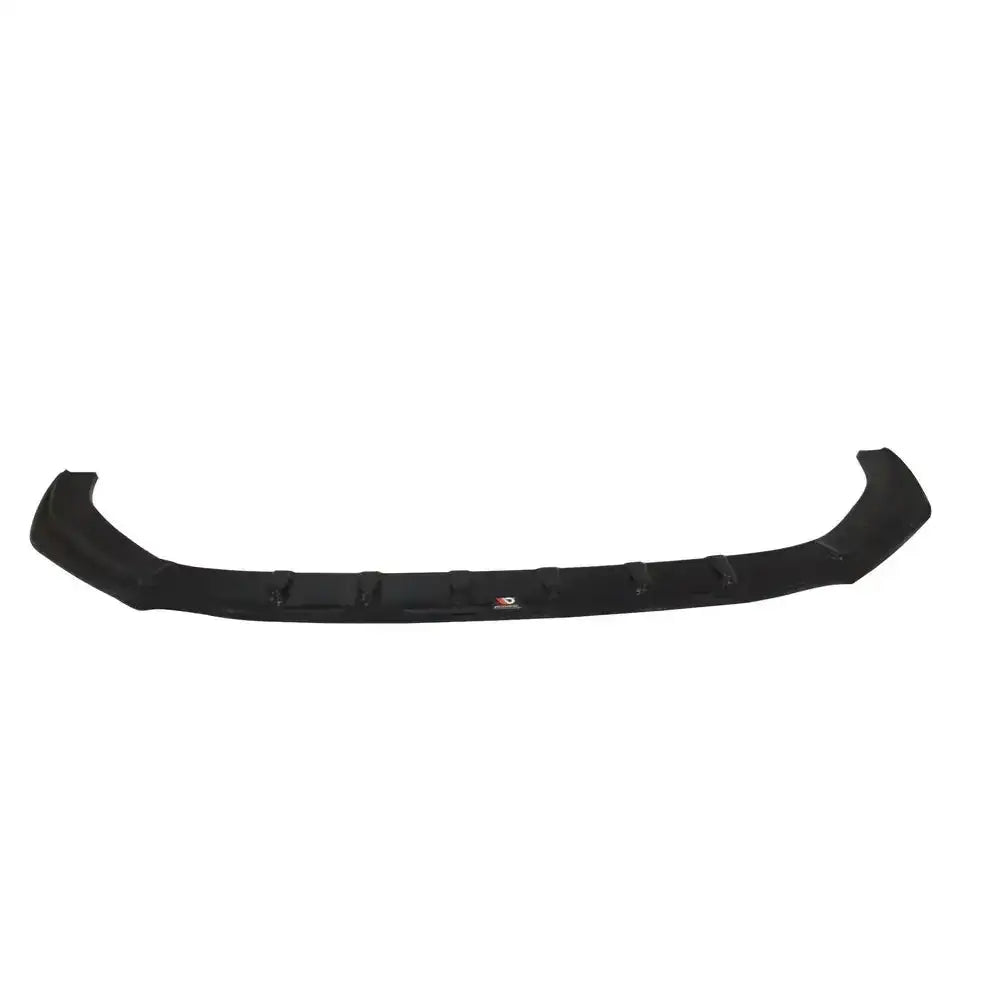 Frontsplitter til Audi RS5 F5 V.1, sort plast med synlige monteringspunkt, sett forfra mot hvit bakgrunn.