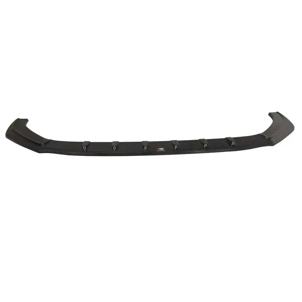 Front lip Audi Rs5 F5 Coupe spoiler i sort plast med vertikale finner, sett ovenfra mot hvit bakgrunn.