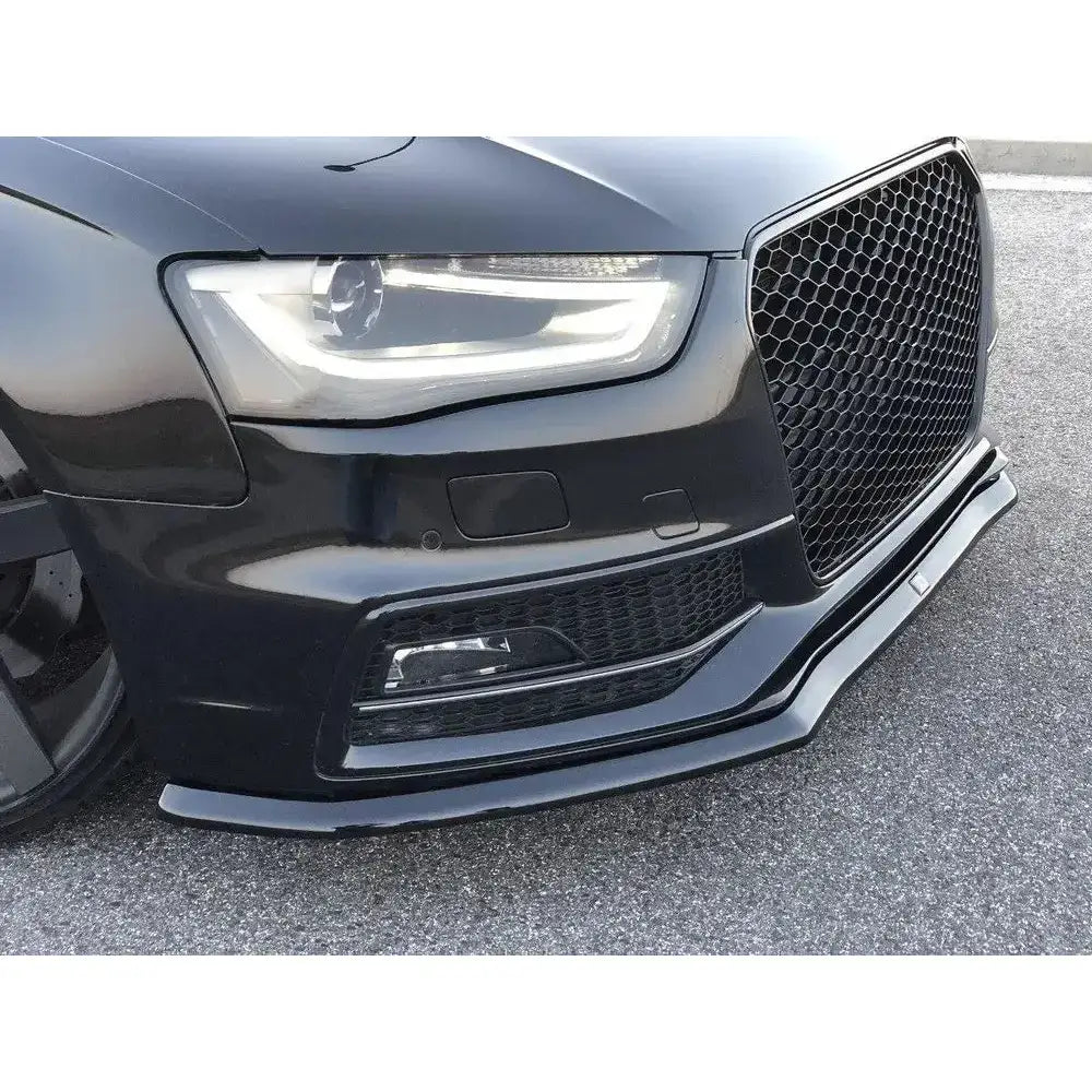 Frontsplitter på Audi S4 B8 FL, nærbilde av plastleppen foran grill og lykter mot asfalt.