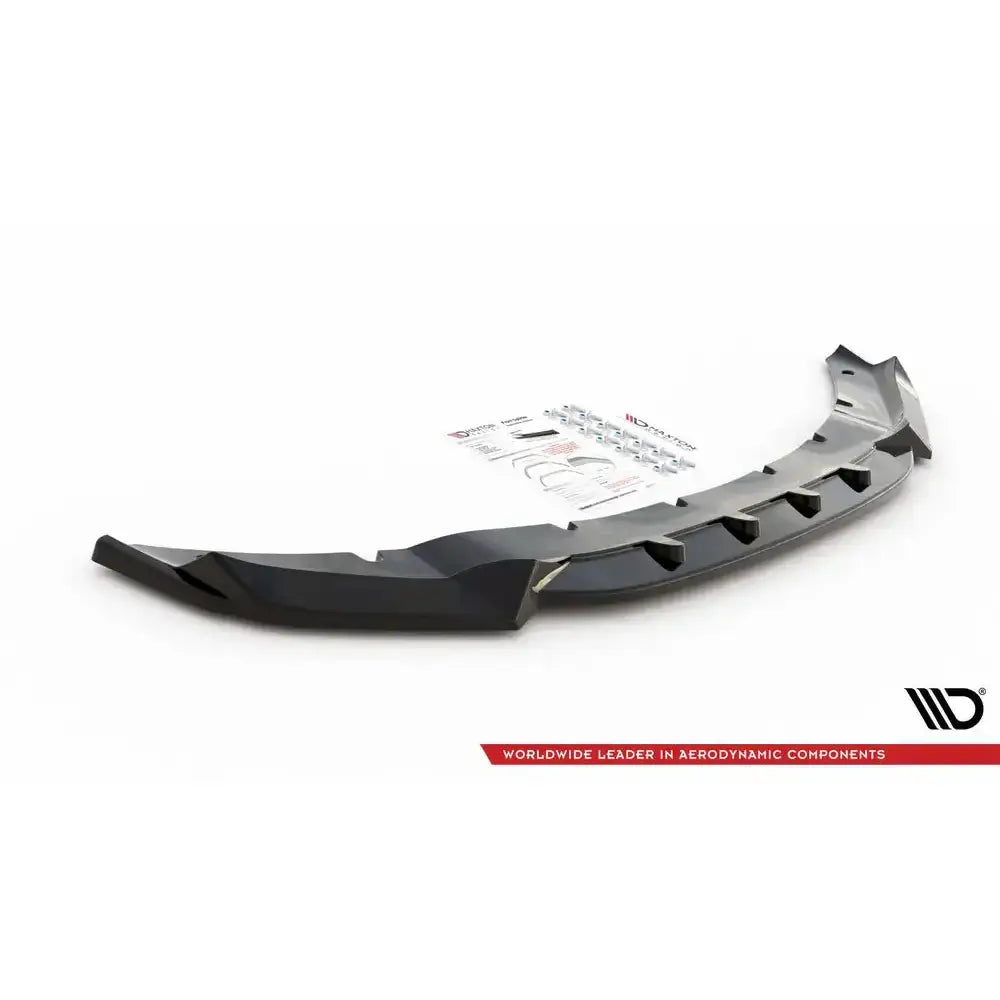 Frontspoiler til Bmw X5 M F15 V.1 i sort plast, skrå vinkel, med luftkanaler og monteringsutstyr.