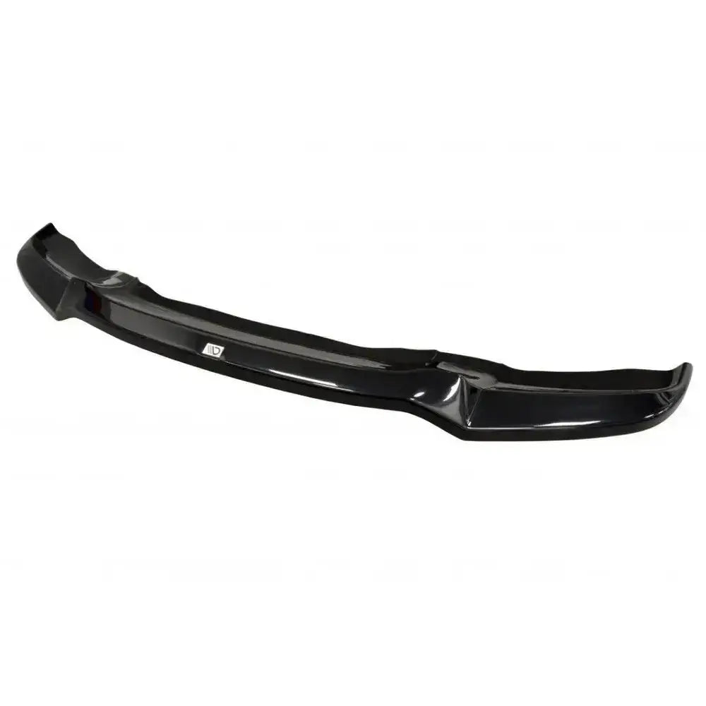 Front lip til BMW X6 F16 Mpack i sort blank plast, sett skrått ovenfra med logo på midten.