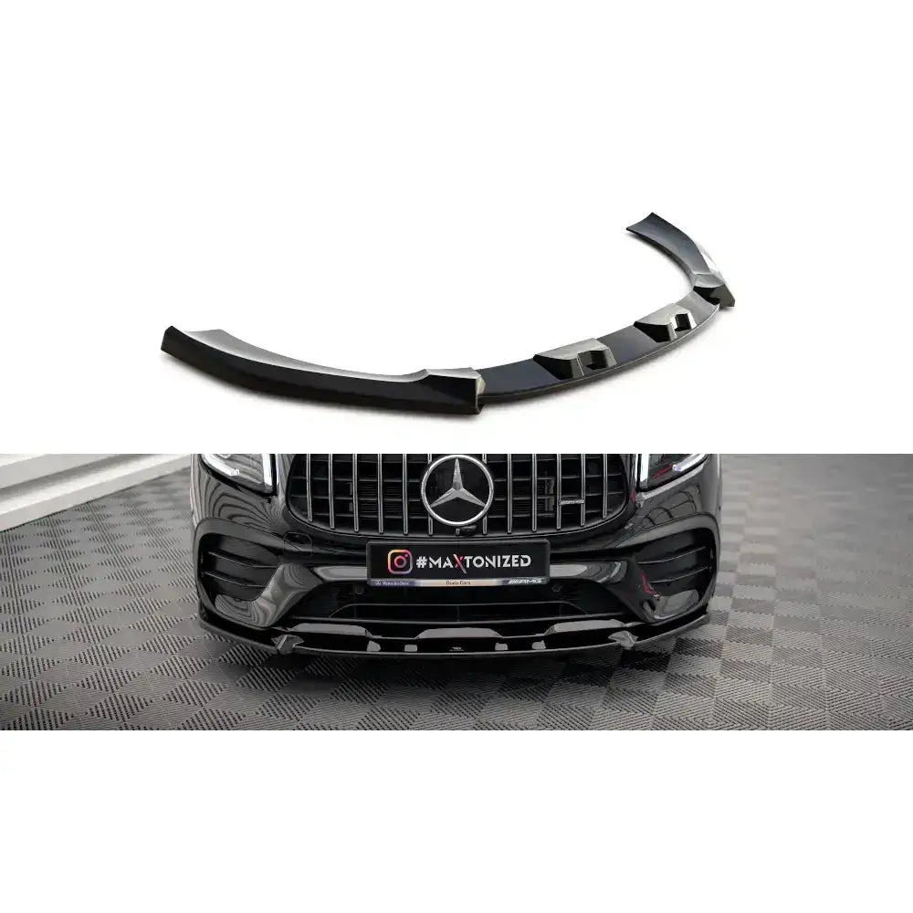 Frontleppe til Mercedes-AMG GLB 35 X247, sort blank plast med monteringsdetaljer, vist på frontfanger.