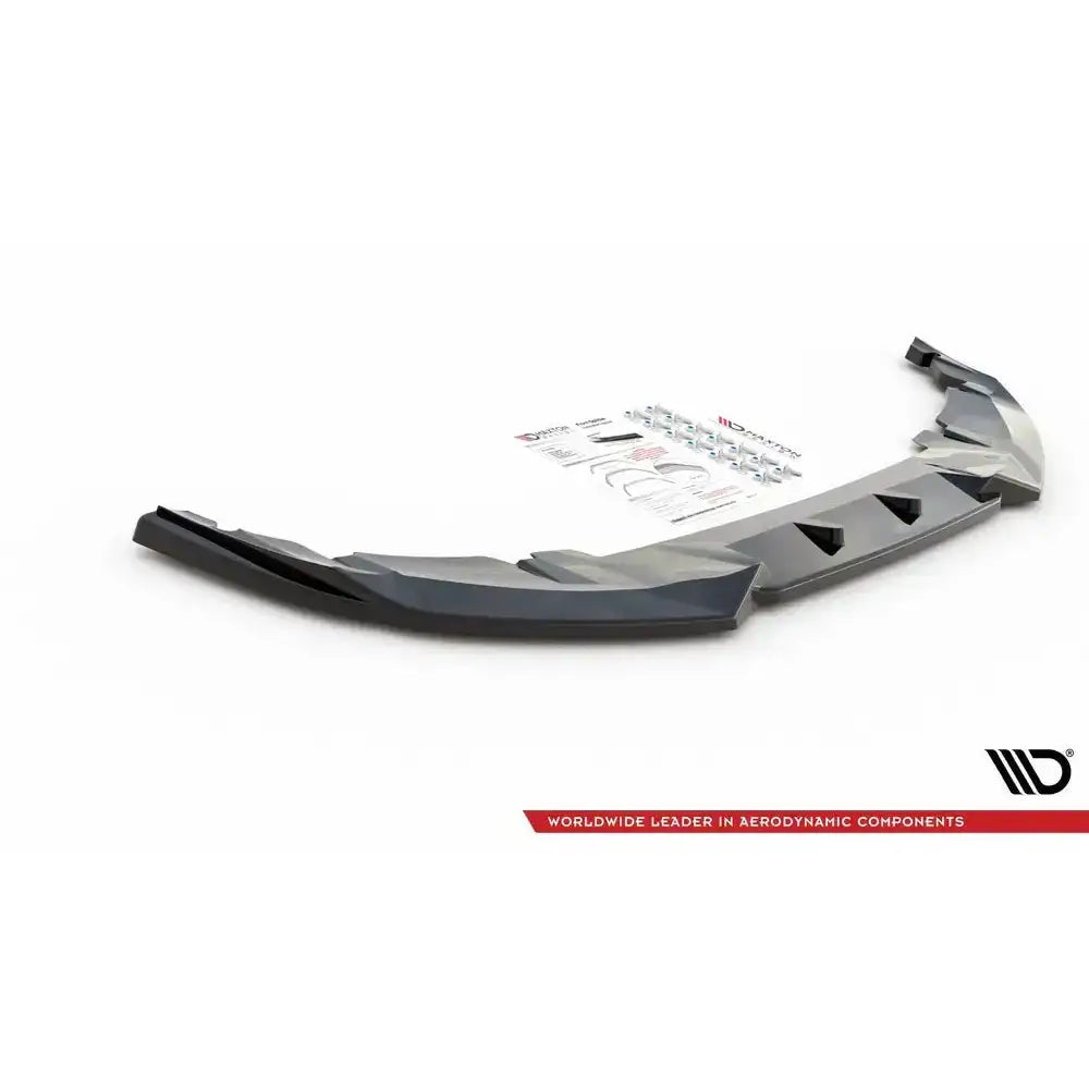 Frontleppe til Mini Countryman Mk2 F60 JCW, sort plastdel med monteringssett og instruksjonsark bak.