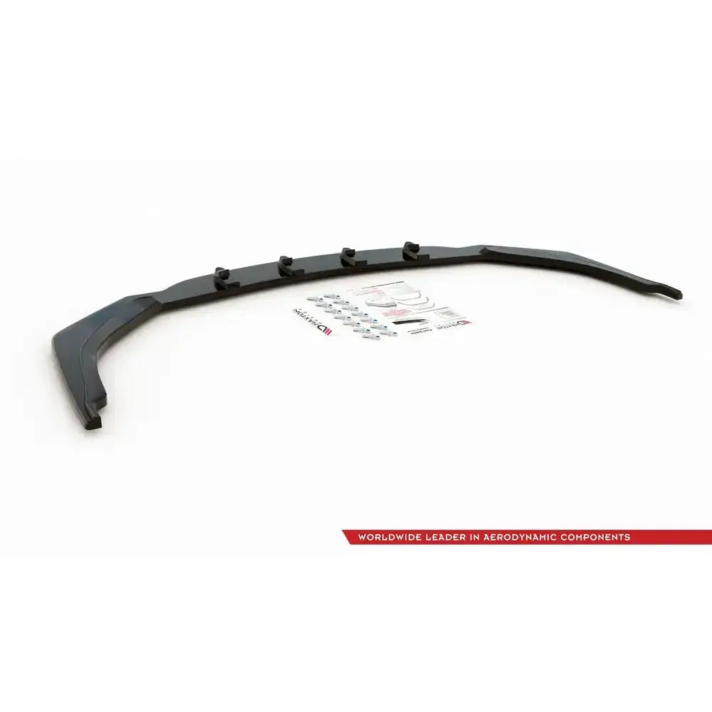 Front lip til Toyota Corolla XII, sort plast med monteringsutstyr og klistremerker, sett ovenfra.