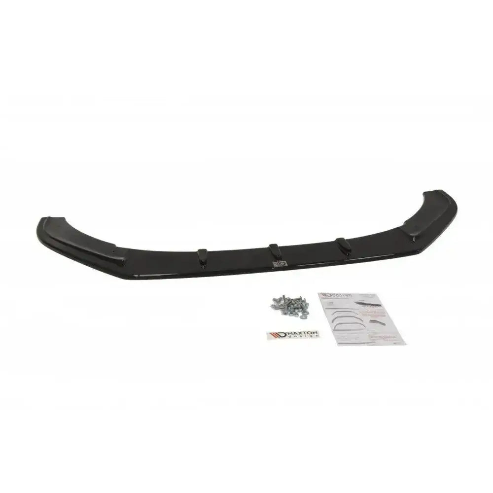 Frontsplitter til VW Polo Mk5 GTI V.1 sett ovenfra med monteringsskruer, instruksjonsark og etikett.