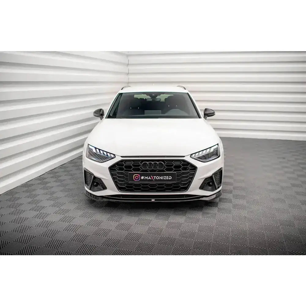 Frontspoiler på Audi A4 S-Line B9 Facelift, hvit bil sett forfra med sort grill og LED-lykter.