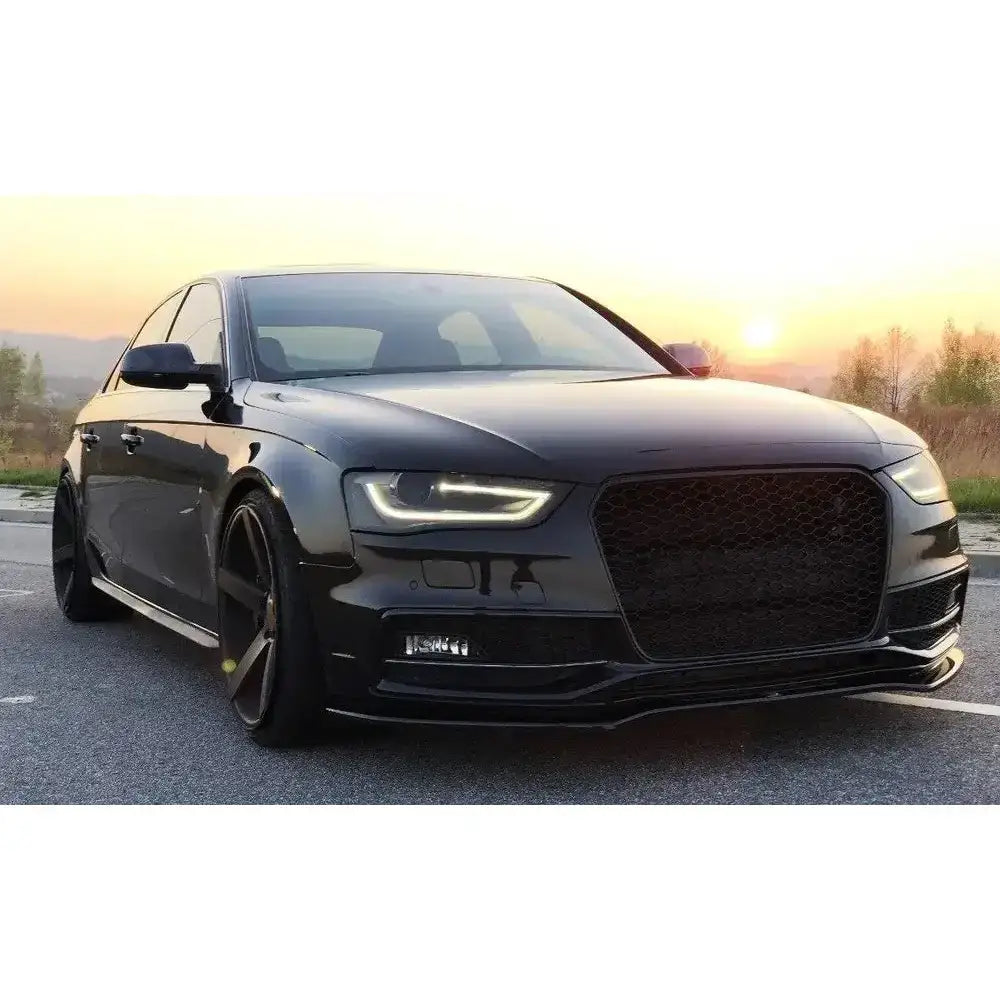 Frontspoiler på Audi S4 B8 FL med store felger og sort grill i solnedgang.