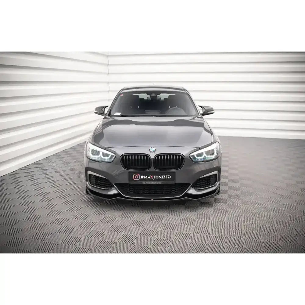 Frontspoiler på grå BMW 1 F20/F21 M-Power med sorte grilldetaljer og skarpe LED-frontlykter.