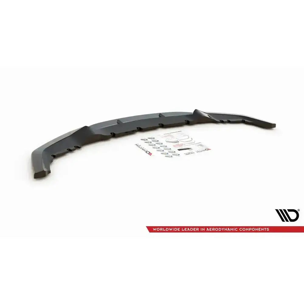 Front splitter til Bmw M2 F87 V.2, sort plast, med monteringsutstyr og instruksjoner på hvit bakgrunn.