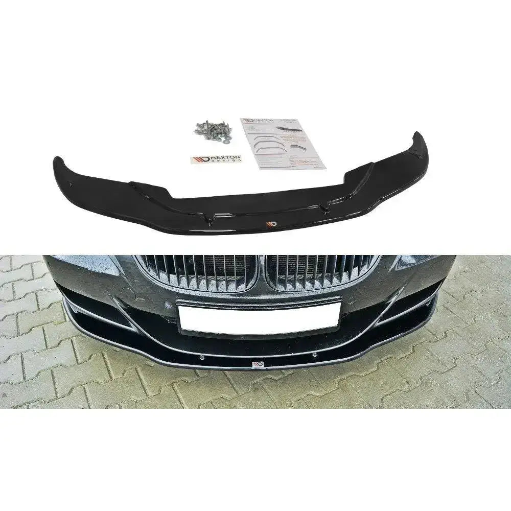 Frontleppe V.2 Bmw M6 E63 i sort plast sett ovenfra med monteringsutstyr og montert på bil forfra.