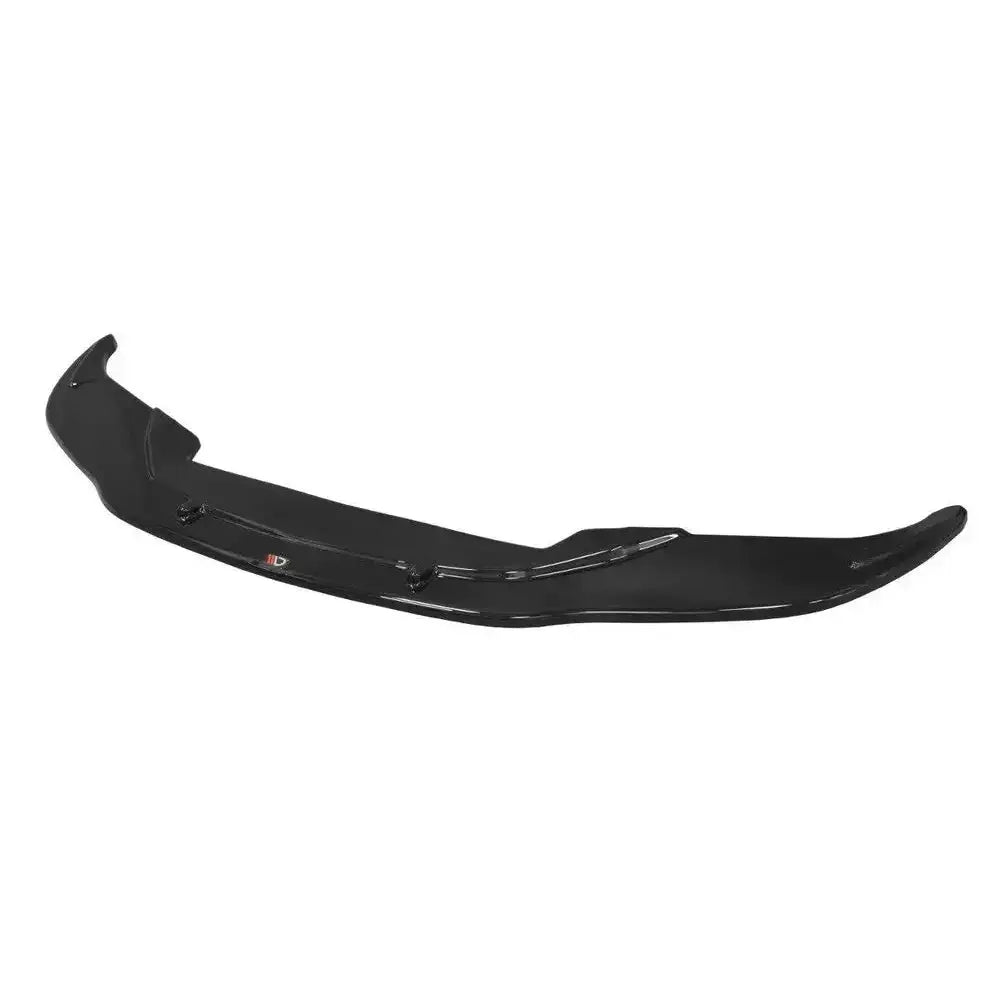 Front splitter til BMW M6 E63 i blank sort plast, skrå oversiktsvinkel med avrundede kanter og monteringspunkter.