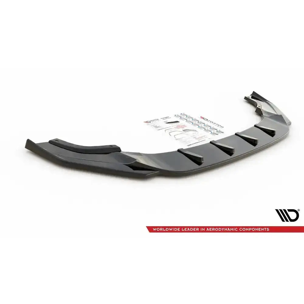 Frontspoiler til Vw Golf 7 R Facelift V.9, sort plast med finner og monteringsutstyr synlig bak.