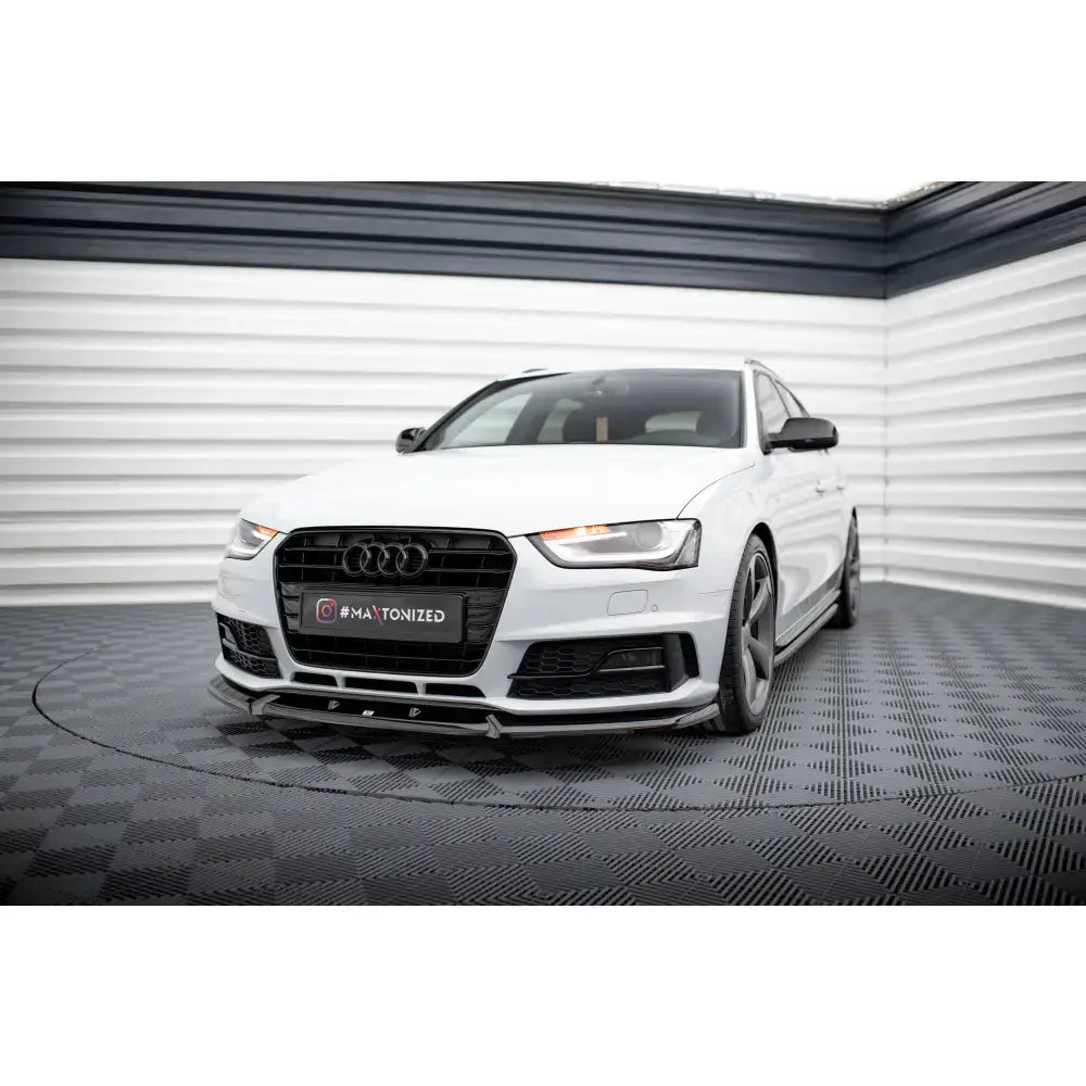 Frontspoiler på Audi A4 Competition B8 Facelift, hvit bil med svarte detaljer og lavt frontskjørt.