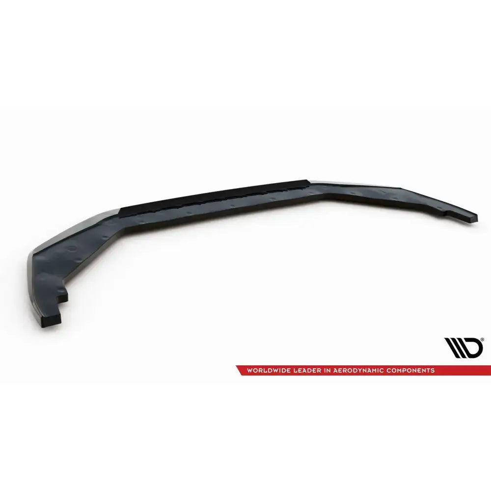 Front splitter til Nissan GTR R35 Facelift, svart plastdel med festehull, sett fra skrå vinkel mot hvit bakgrunn.