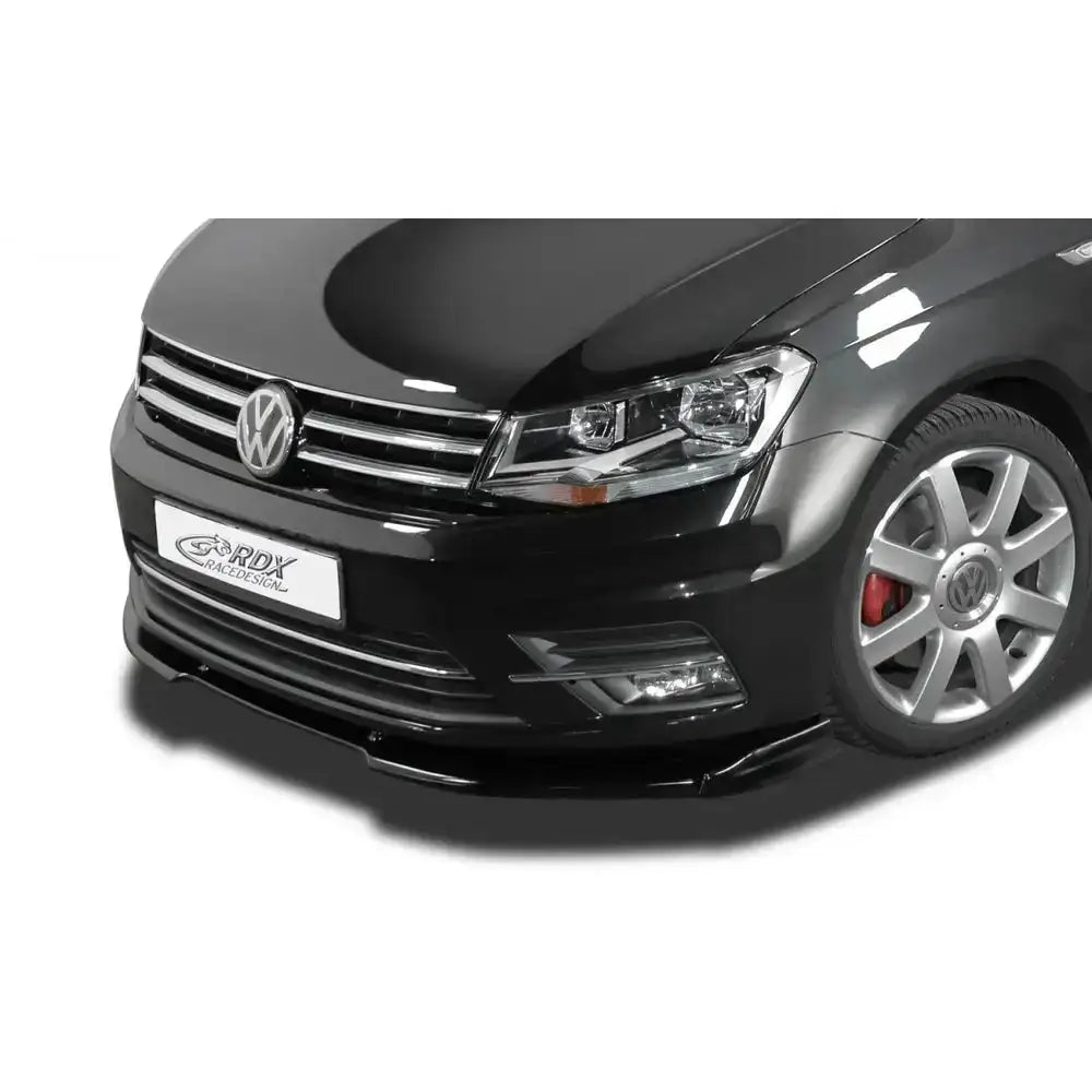 Frontleppe V1 på Volkswagen Caddy 2K 15-20, sort frontparti med kromdetaljer og lav spoiler.