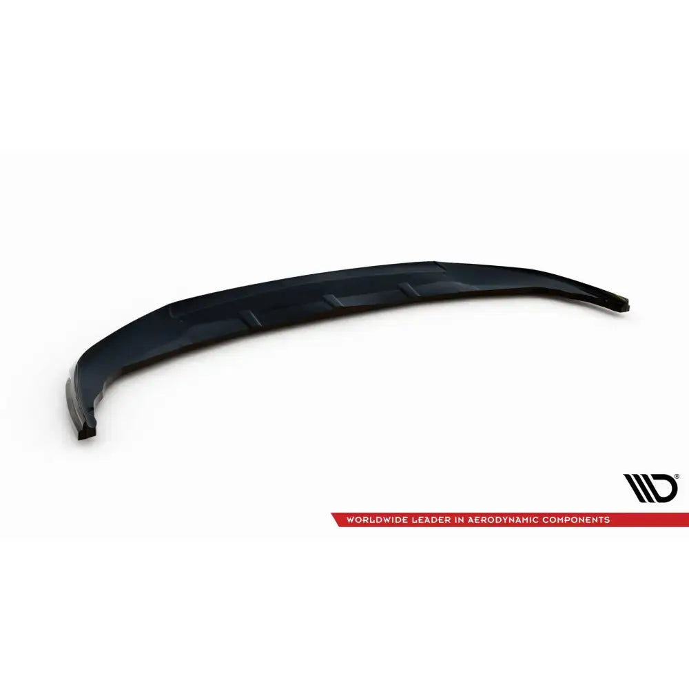 Frontspoiler til BMW 1 F40 V2 i svart plast med markerte kanter, sett ovenfra mot hvit bakgrunn.