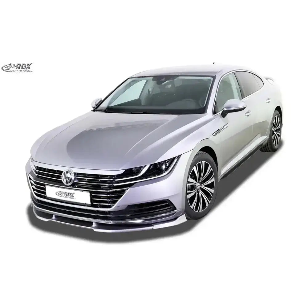 Frontspoiler Volkswagen Arteon 17-20 med sorte og kromdetaljer, sett skrått forfra på sølvfarget bil.