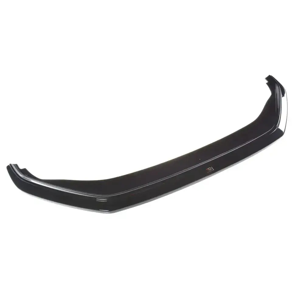 Frontsplitter til Vw Golf Mk7 Facelift i sort blank plast, sett ovenfra med detaljer og emblem på hvit bakgrunn.