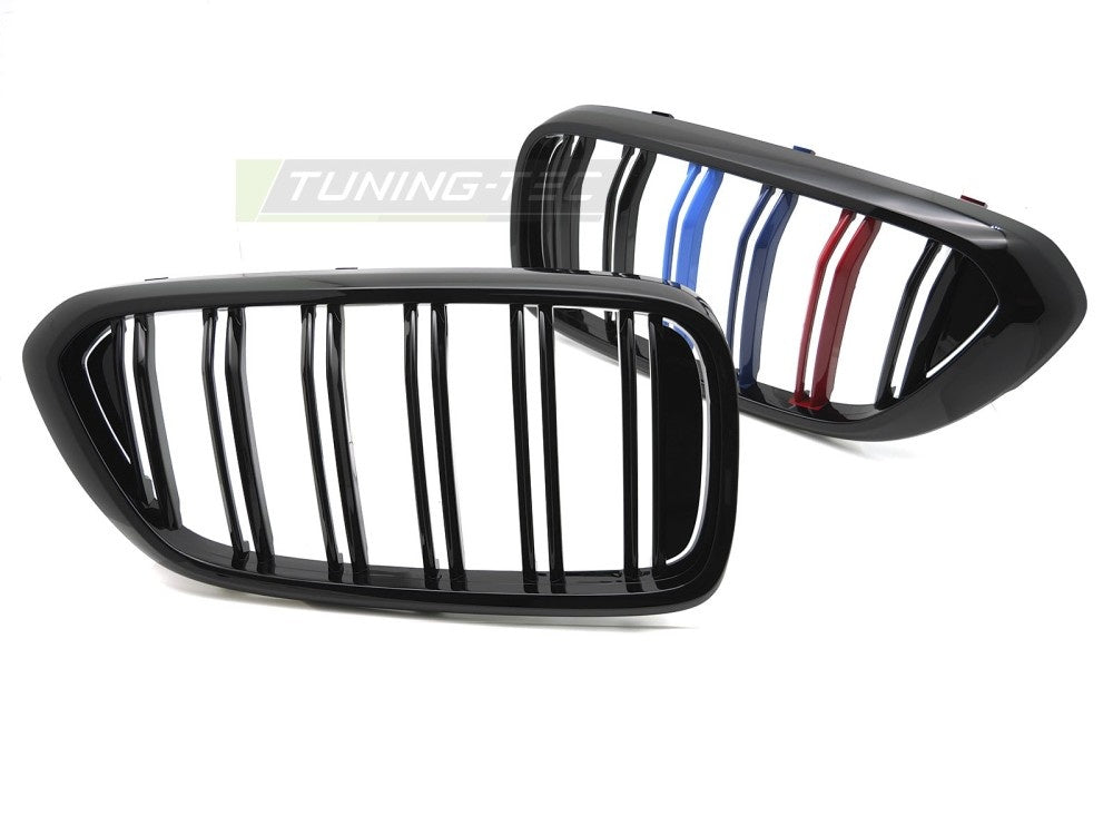 Nærbilde av glossy svart grill med tri-color striper til BMW G32 2017–2020