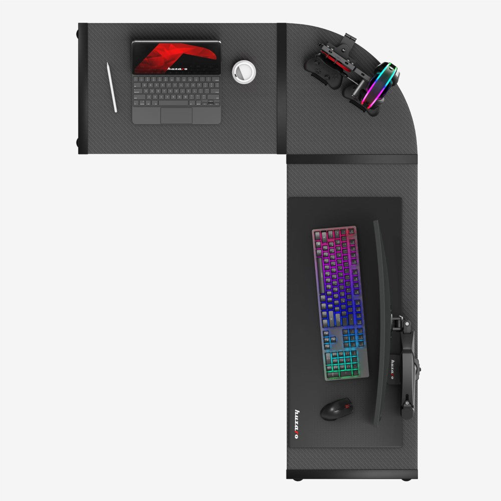 Huzaro Hero 6.0 svart gamingbord – nærbilde av mørkt carbonbelegg på bordflaten