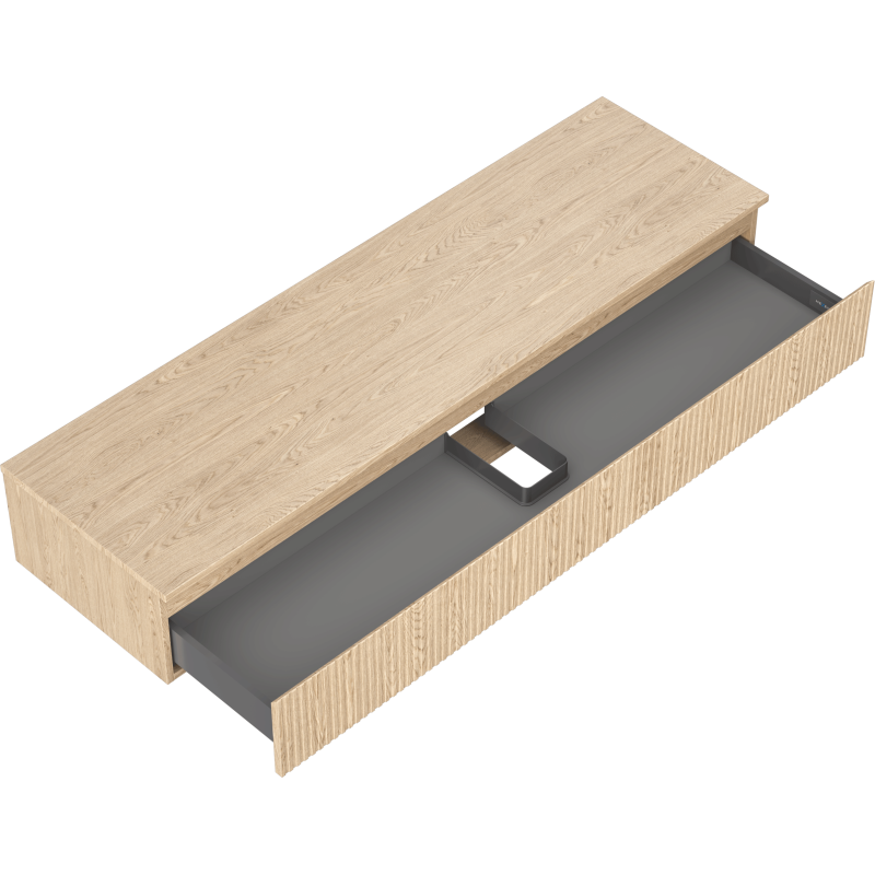 Servantskap uten vask i lyst eik med riflet front, én stor grå skuff og åpning for kabelføring.