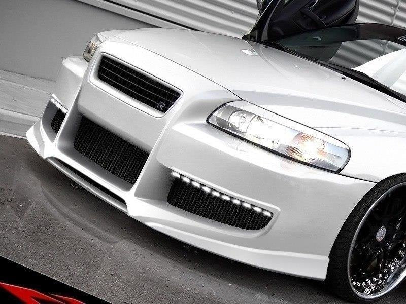 Lyktebryn i blank sort ABS til Volvo S60 Mk1, montert over frontlyktene