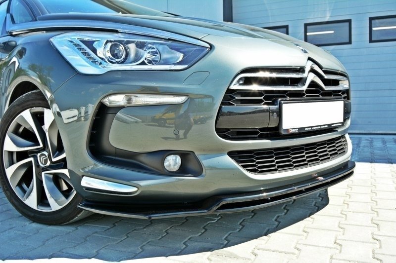 Frontleppe på Citroen Ds5 V.3, nærbilde av grill, høyre hovedlykt og felg med kromdetaljer.