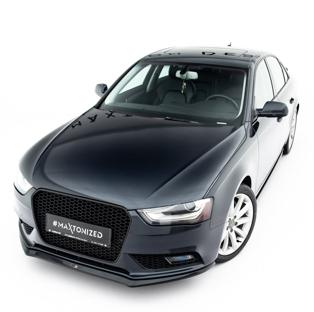 Frontspoiler Audi A4 B8 FL V.2 montert på mørk grå bil sett forfra med hvite felger og sort grill.