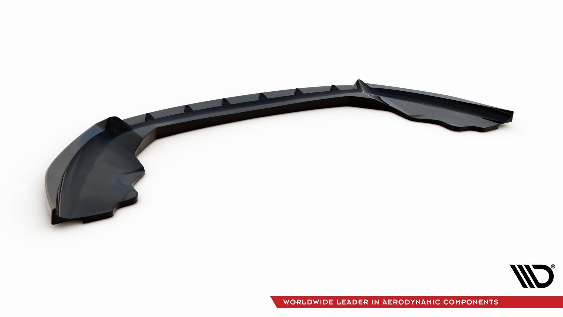 Front lip for Ford Fiesta St MK7 Facelift V.4 i svart blank plast med aerodynamiske spor, sett skrått ovenfra.