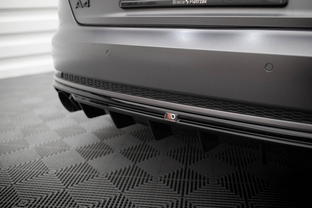 Nærbilde av bakvalanse i strukturert svart ABS-plast for Audi A4 S-Line B9