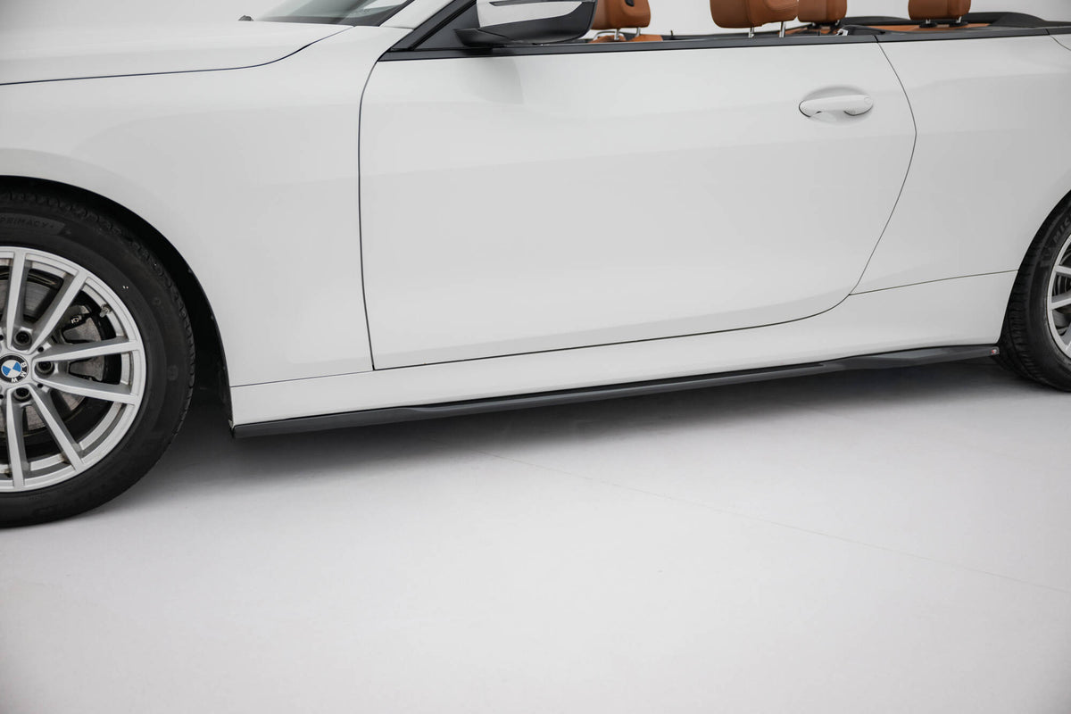 Bakre diffuser fra splittersett på BMW 4 Cabrio G23, sett rett bakfra under eksospartiet