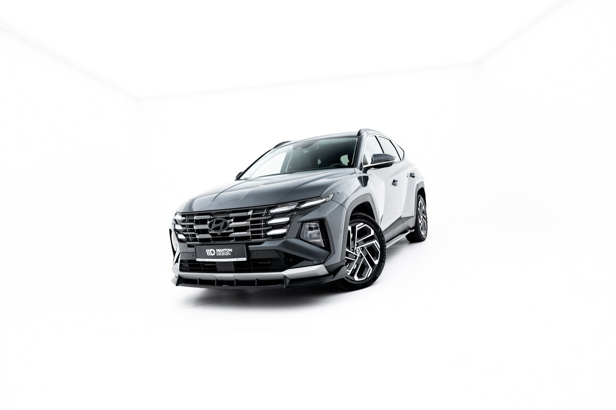 Nærbilde av blank sort ABS-overflate på splittersett til Hyundai Tucson Mk4