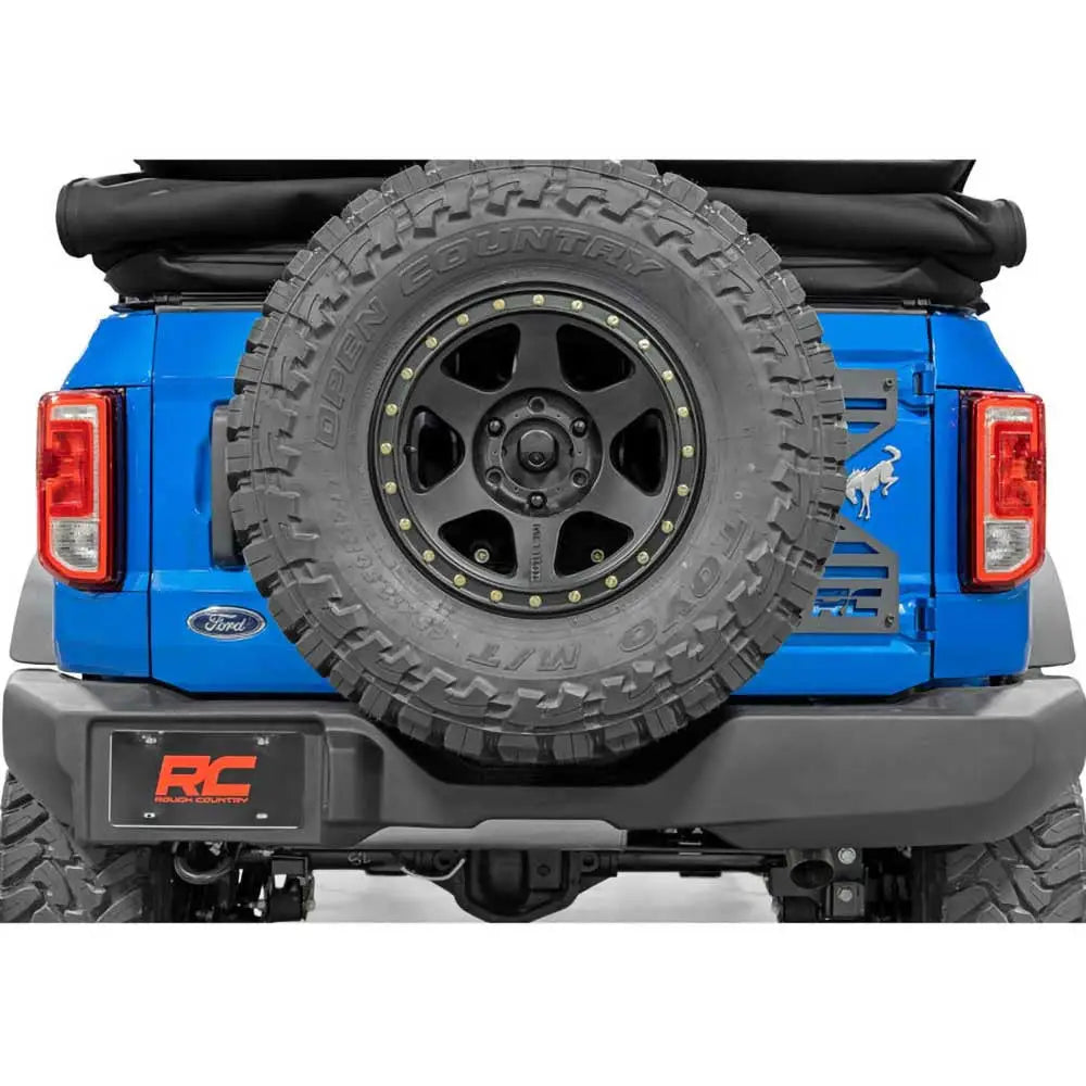 Repositioning av Reservehjulholder med Klaffforsterkning - Ford New Bronco 4 d 21-