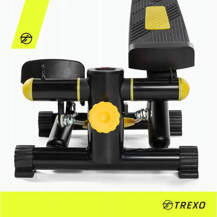 Stepper for aerobic trening, frontvisning med synlige skruhåndtak, strukturert fotplate og gul detalj mot lys bakgrunn.