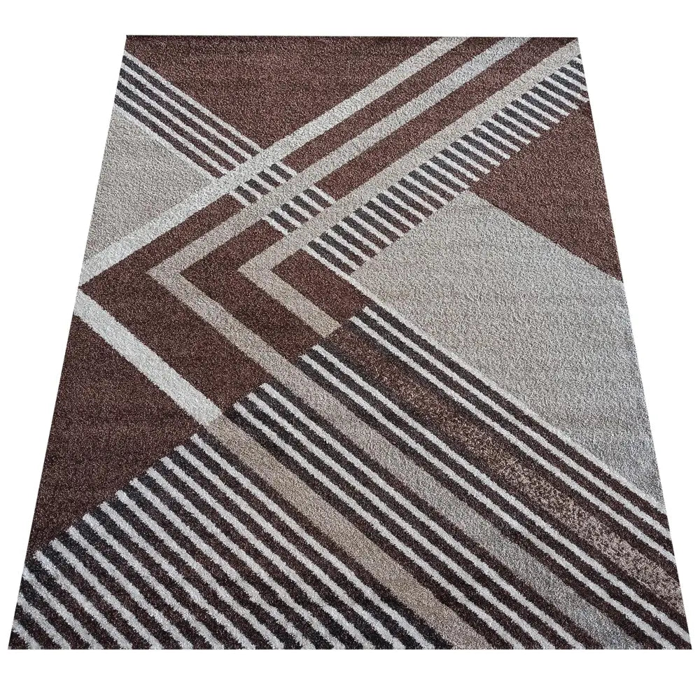 Tepe Otto teppe 200 x 290 cm med geometrisk mønster i brune, beige og grå nyanser, sett ovenfra.