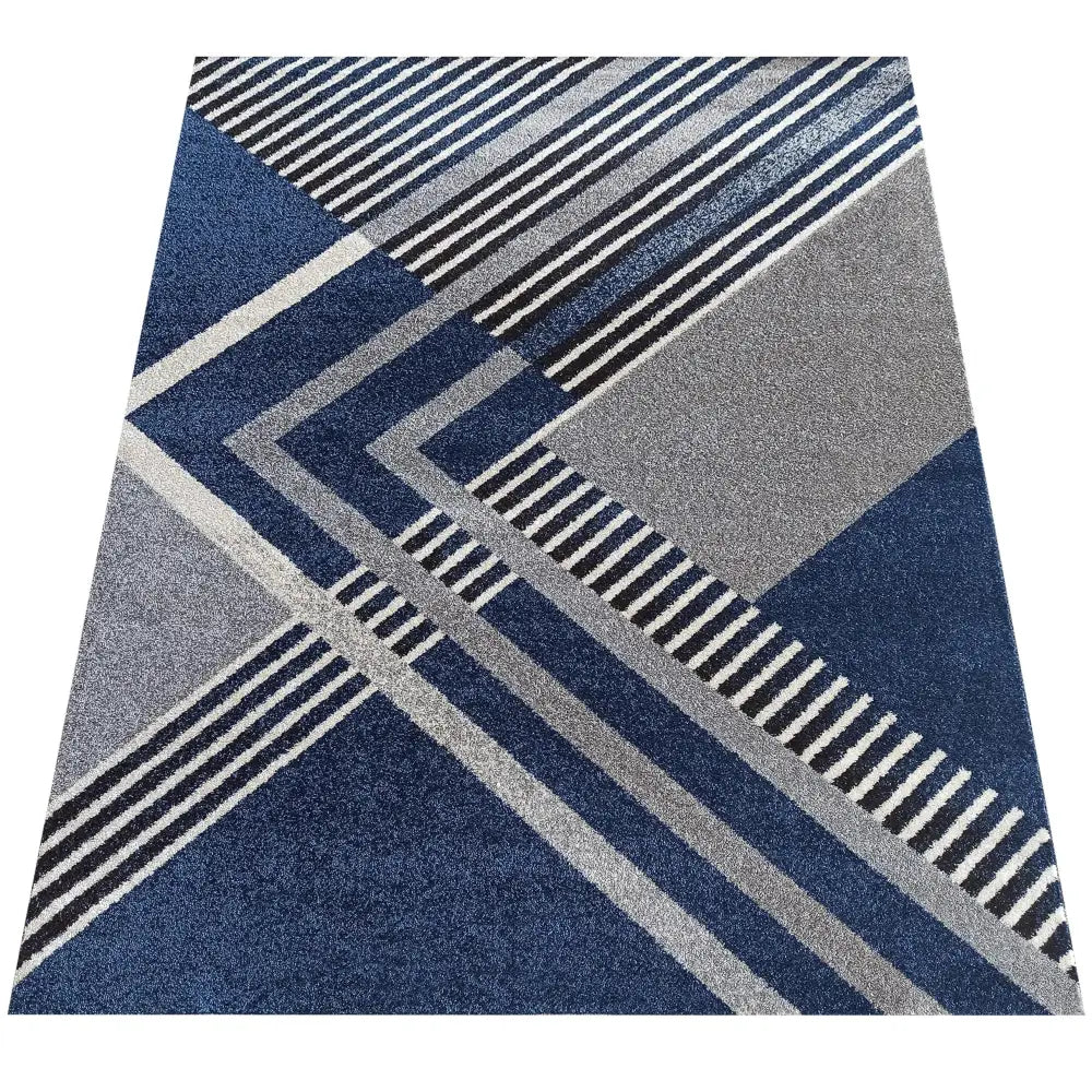 Tepe Otto teppe 200 x 290 cm, geometrisk mønster i blått, grått og hvitt, sett ovenfra.