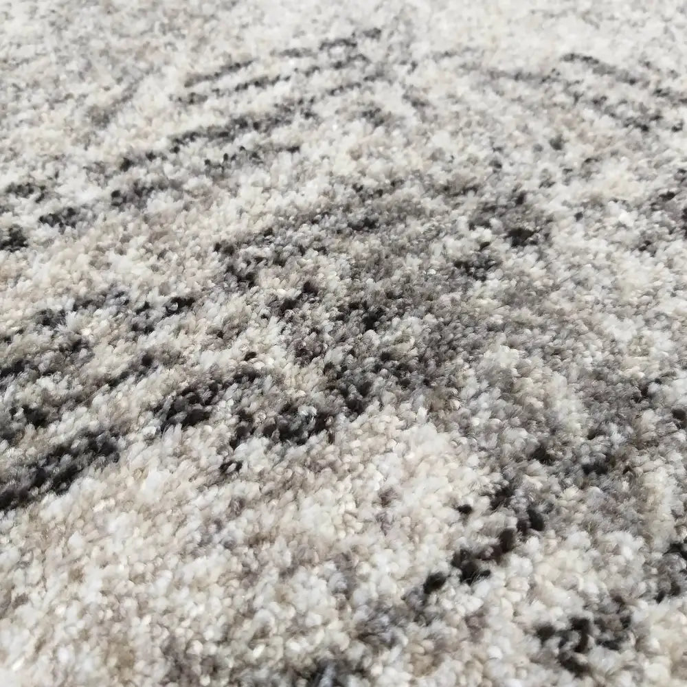 Tepe Panamero 02 grått teppe, nærbilde som fremhever loddent materiale og diskret mønster i grå og beige.