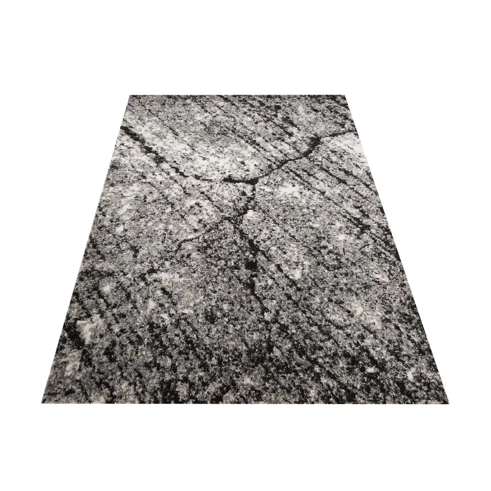 Tepe Panamero 04 grått teppe 200 x 290 cm med marmormønster, skråvisning mot midten på hvit bakgrunn.